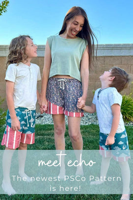 mom and kids smiling with Echo shorts on